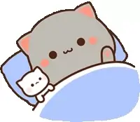 The grey cat, Goma, is shown sleeping soundly in bed with a smaller white cat. The scene is cozy and suggests a peaceful rest.